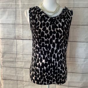 Tahari women’s shell in a beautiful black and white pattern size extra small.